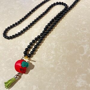 Black Beaded Necklace with Candy Skill Wooden & Leather Charm